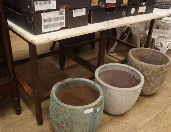 A marble top garden table on later two-part metal base W.137cm